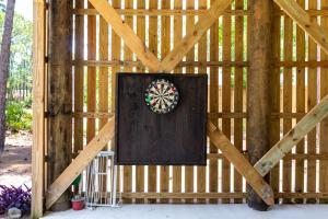 a dart board on the wall of a barn at Turtles Nest in Dauphin Island
