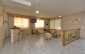 a living room with a table and chairs at KIPRIANOS - STUDIOS in Loutra Edipsou
