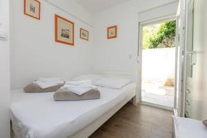 Katil atau katil-katil dalam bilik di Sea Sound Apartments Rea