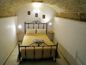 Postel nebo postele na pokoji v ubytování La Vecchia Grotta