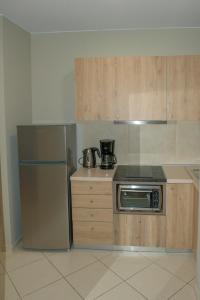 Kuchyň nebo kuchyňský kout v ubytování Rafaela Apartments