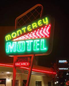 a neon sign on a neon sign post at The Monterey Motel in Albuquerque