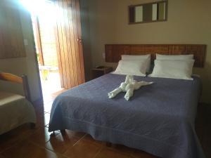 Postel nebo postele na pokoji v ubytování Itaoca Pousada