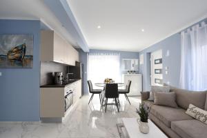 a living room with a couch and a kitchen with a table at Endless Summer House Barbara Zadar in Zadar