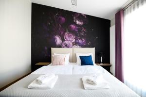 Łóżko lub łóżka w pokoju w obiekcie Aparthotel Inspire Miodova Residence