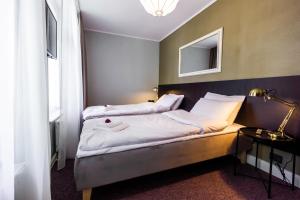 Postel nebo postele na pokoji v ubytování Hotel Marino