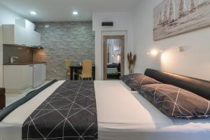 Postel nebo postele na pokoji v ubytování Apartments Orlic