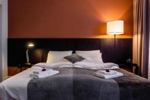 Postel nebo postele na pokoji v ubytování Hotel Marino