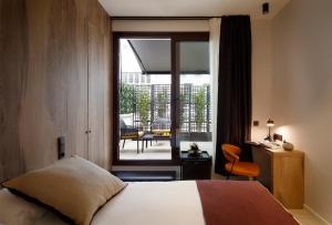 Katil atau katil-katil dalam bilik di Munna Hotel Boutique