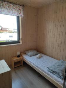 Postel nebo postele na pokoji v ubytování Vela Sarbinowo