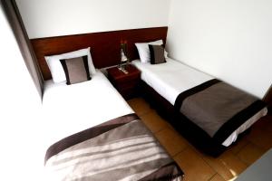 Cama o camas de una habitación en Apart Versalles