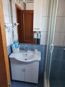 a bathroom with a white sink and a shower at Tazex Apartments in Herceg-Novi +43 photos