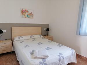 Posteľ alebo postele v izbe v ubytovaní Apartamentos Vista