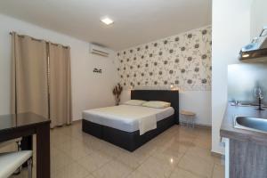 Postel nebo postele na pokoji v ubytování Apartments Orlic