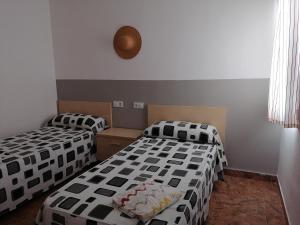 Posteľ alebo postele v izbe v ubytovaní Apartamentos Vista