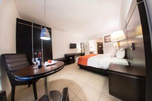 Postel nebo postele na pokoji v ubytování HOTEL OLIBA Boca del Rio