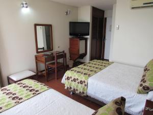 Hotel Don Lolo客房内的一张或多张床位