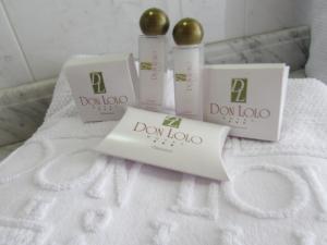 a group of three products sitting on a bed at Hotel Don Lolo in Villavicencio