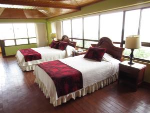 Hotel Don Lolo客房内的一张或多张床位