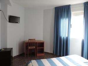 Cama ou camas em um quarto em Hotel Costa San Antonio