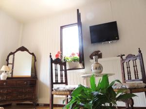 TV a/nebo společenská místnost v ubytování Villa Palmer I Beachhouse