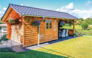 a wooden cabin with a gazebo at 1 Bedroom Cozy Apartment In Kappeln in Kappeln +21 photos