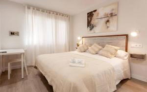 Säng eller sängar i ett rum på Hotel Prada.