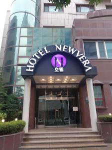 a sign on the front of a building at HOTEL Newvera in Cheongju