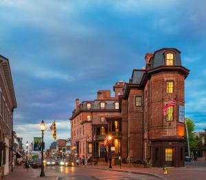 a tall brick building on a city street at Historic Inns of Annapolis in Annapolis