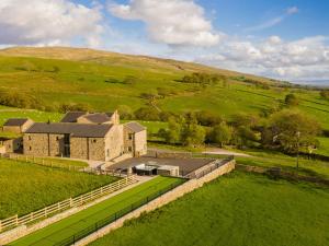 an aerial view of a large house in a field at High View Barn in Carnforth