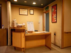 an office with a desk in a room at Ryokan Hakura in Yamanouchi +105 photos
