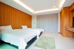 Un ou plusieurs lits dans un hébergement de l'établissement U-Home Private 80-86sqm adjustable 2bedrooms Wooden Decor 80平米