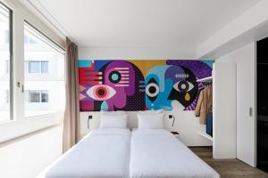 Postel nebo postele na pokoji v ubytování B&B HOTEL St Gallen