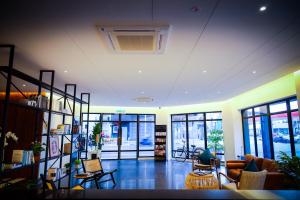 a large living room with a lot of windows at The Journey hotel in George Town