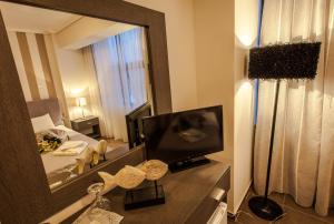TV a/nebo společenská místnost v ubytování Aqua Mare Sea Side Rooms