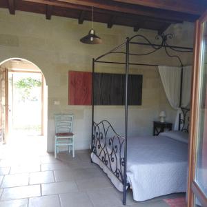 Katil atau katil-katil dalam bilik di Masseria Copertini