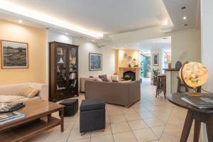 a living room with a couch and a table at Yria Hotel in Zakynthos Town
