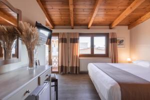 a hotel room with a bed and a window at Yria Hotel in Zakynthos Town