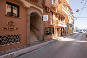 an empty street in front of a building at Yria Hotel in Zakynthos Town