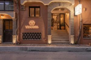 a building with a sign that reads van hotel at Yria Hotel in Zakynthos Town