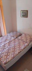 A bed or beds in a room at Aqua Hostel