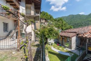 a view from the balcony of a house with a hammock at Erve Come Una Volta Casa Vacanza 