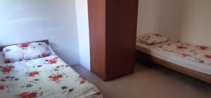 A bed or beds in a room at Aqua Hostel