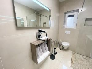 Kúpeľňa v ubytovaní Apartmani Oaza
