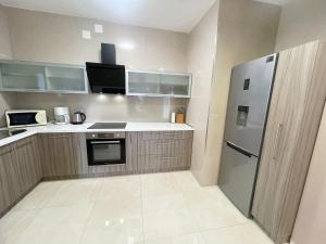 Kuchyňa alebo kuchynka v ubytovaní Apartmani Oaza
