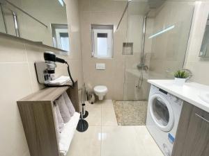 Kúpeľňa v ubytovaní Apartmani Oaza