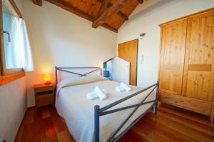 a bedroom with a bed with two pillows on it at Ca Ponte dei Greci S163 in Venice