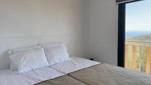 En eller flere senge i et værelse på Agallio Nature Resort - Adults Only