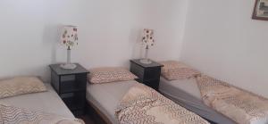 A bed or beds in a room at Aqua Hostel