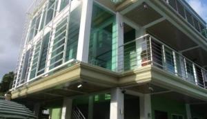 a building with a balcony on the side of it at Reddoorz @ Sta Cruz Naga City in Naga